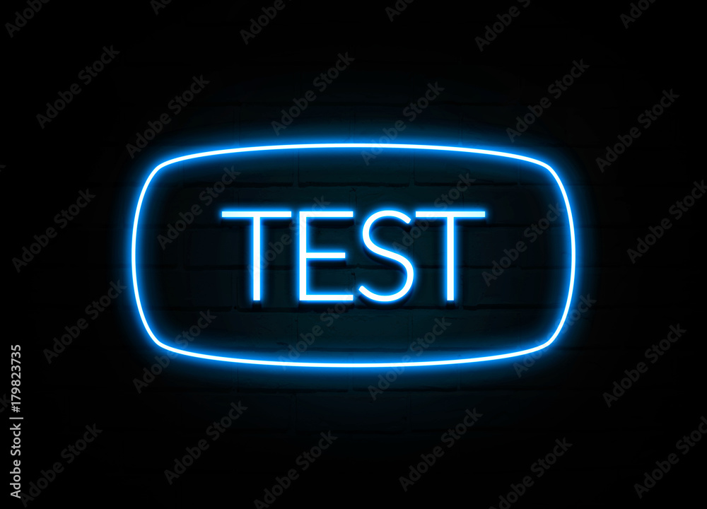 Test - colorful Neon Sign on brickwall Test - colorful Neon Sign on brickwall
