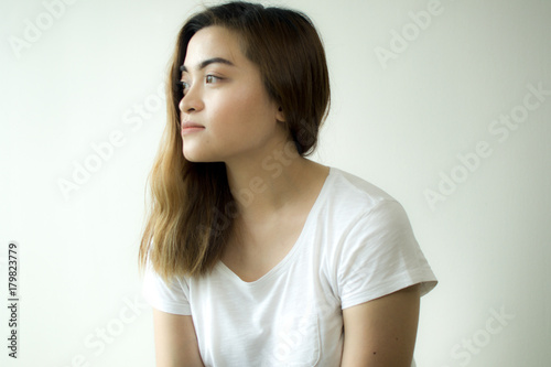 A portrait of a woman wearing a white shirt