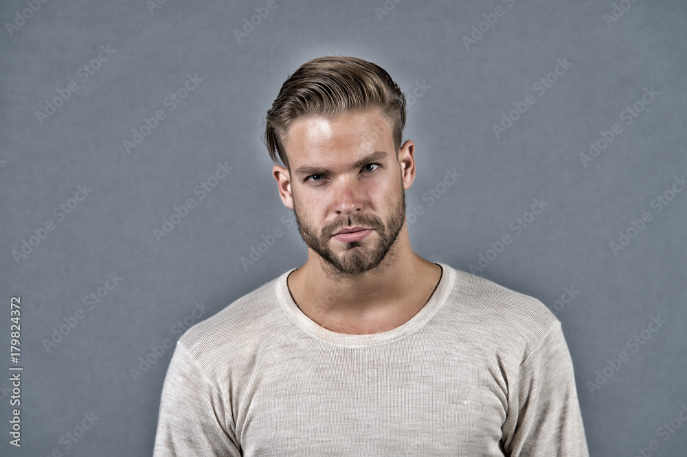 Macho with bearded face and stylish hair in white shirt Macho with bearded face and stylish hair in white shirt