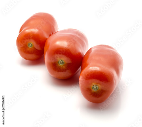 Ripe San Marzano tomato isolated on white background three whole red