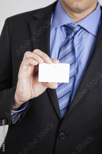 businessman shows his card