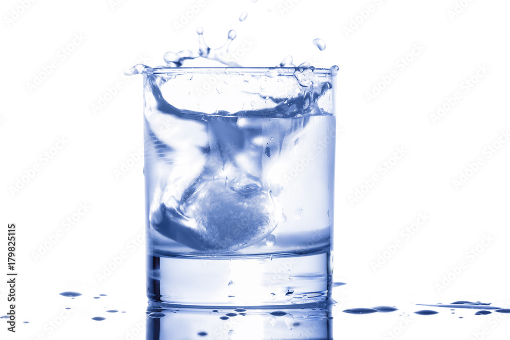 blue water splashing out of a glass with drops blue water splashing out of a glass with drops