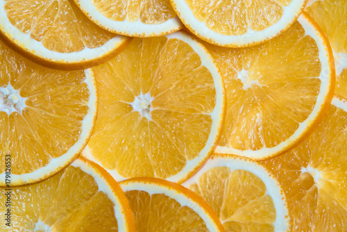 Sliced oranges background  bright fresh fruit cut into even slices