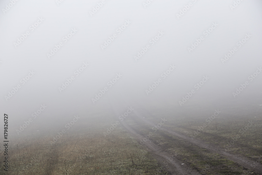 Naklejka premium Fog in the morning at the outskirt of town