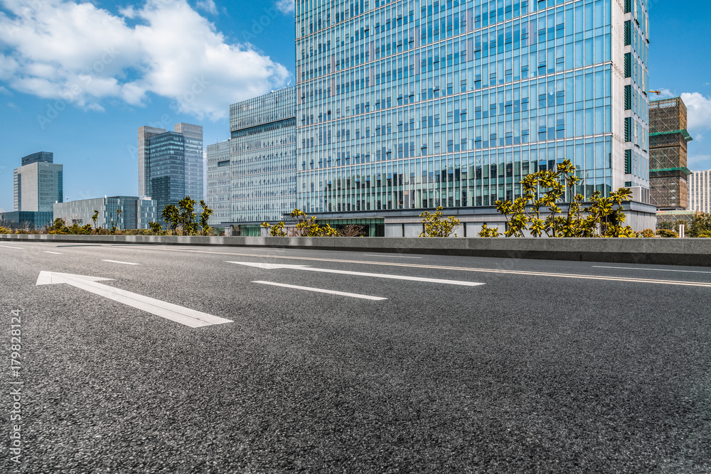 empty asphalt road front of modern buildings. empty asphalt road front of modern buildings.