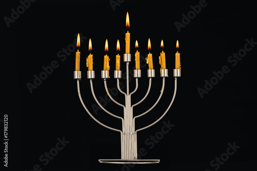 hanukkah celebration with menorah and candles
