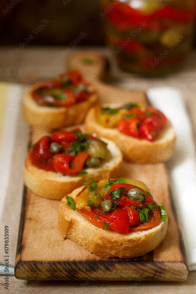 Fresh and tasty bruschetta with pickled bell pepper, capers and parsley. Fresh and tasty bruschetta with pickled bell pepper, capers and parsley.
