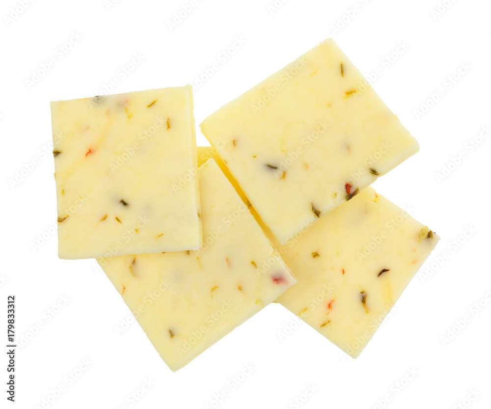 Top view of a group of fresh pepper jack cheese squares isolated on a white background.