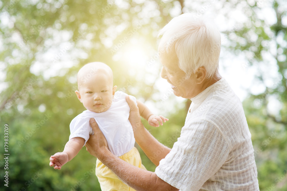 Fototapeta premium Grandparent taking care grandchild.