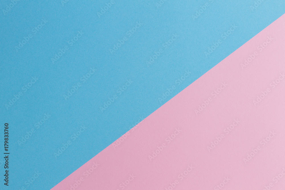 Soft pink and light blue pastel colored paper background.
