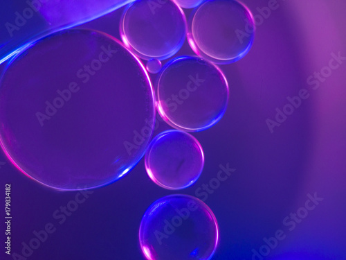 Drops of oil floating in water.