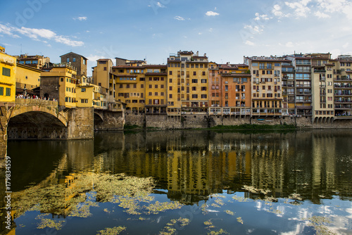Florence cityscape view with Ponte Vecchio  a medieval stone bridge over Arno River.