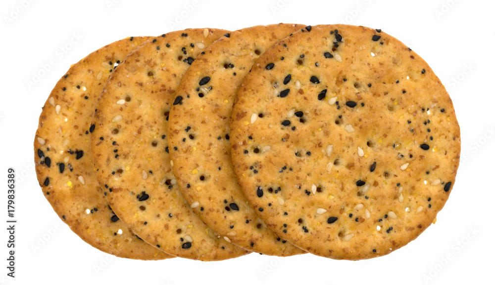 A short row of multi grain baked crackers isolated on a white background. A short row of multi grain baked crackers isolated on a white background.
