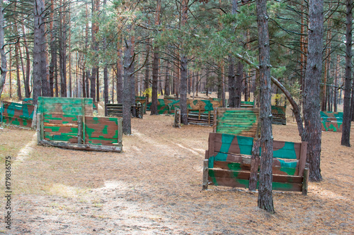 Facilities for playing paintball in the autumn forest © RomanovRV