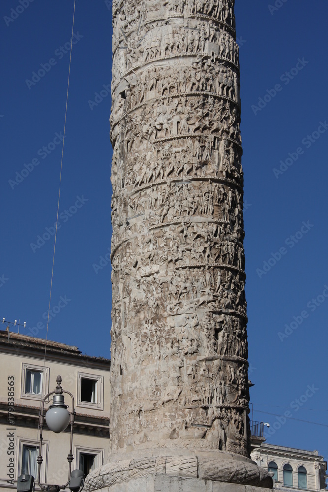 The marble Column of Marcus Aurelius in Piazza Colonna square in Rome, Italy. It is a Doric column about 100 feet high built in 2nd century AD and featuring a spiral relief.