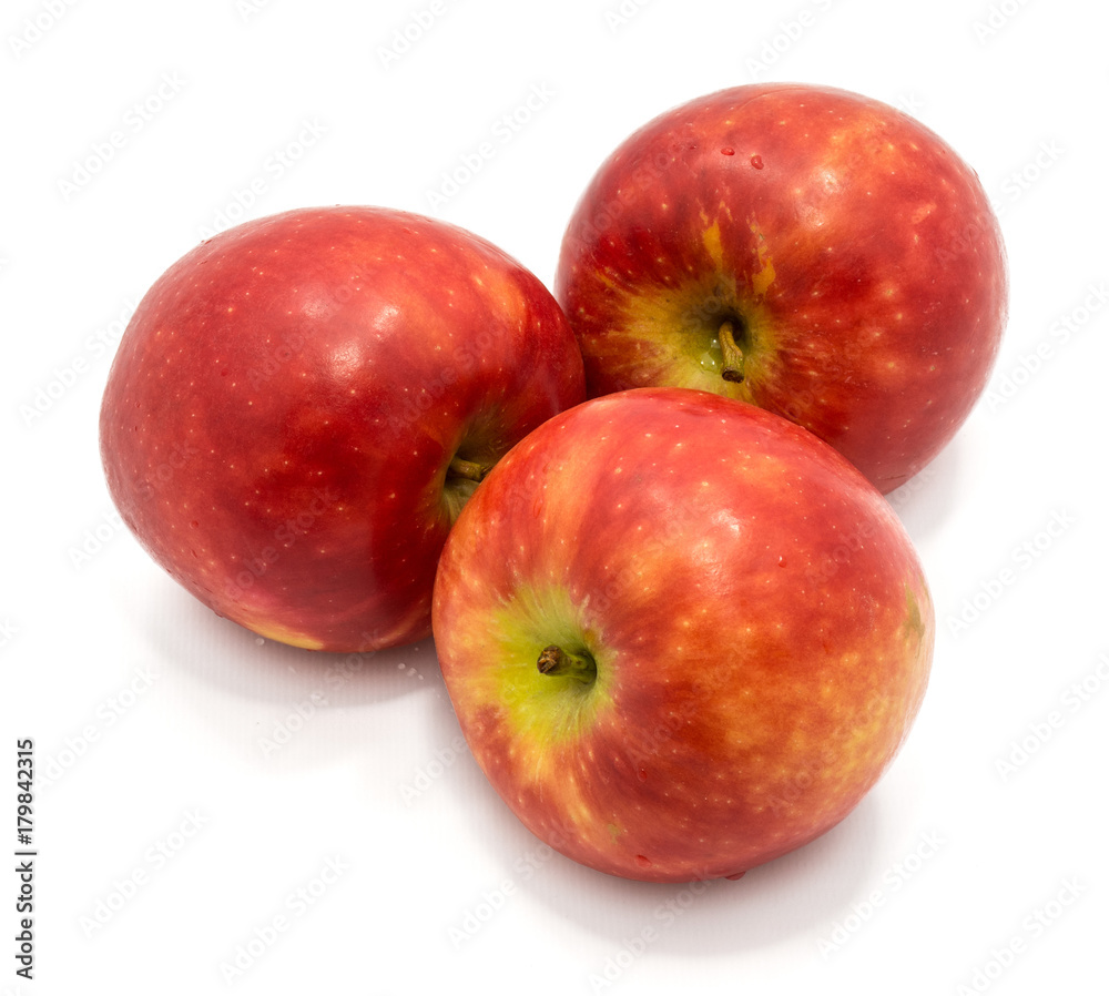 Three whole red Kanzi apples isolated on white background