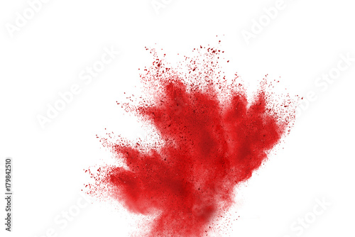 Splash of red powder over white background.