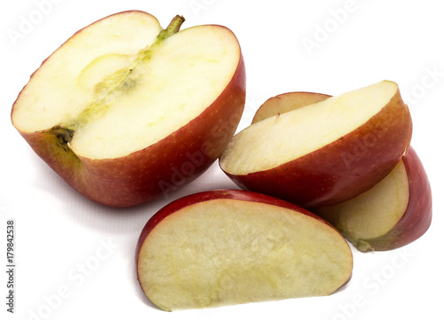 One half Kanzi apple, three slices, isolated on white background photo