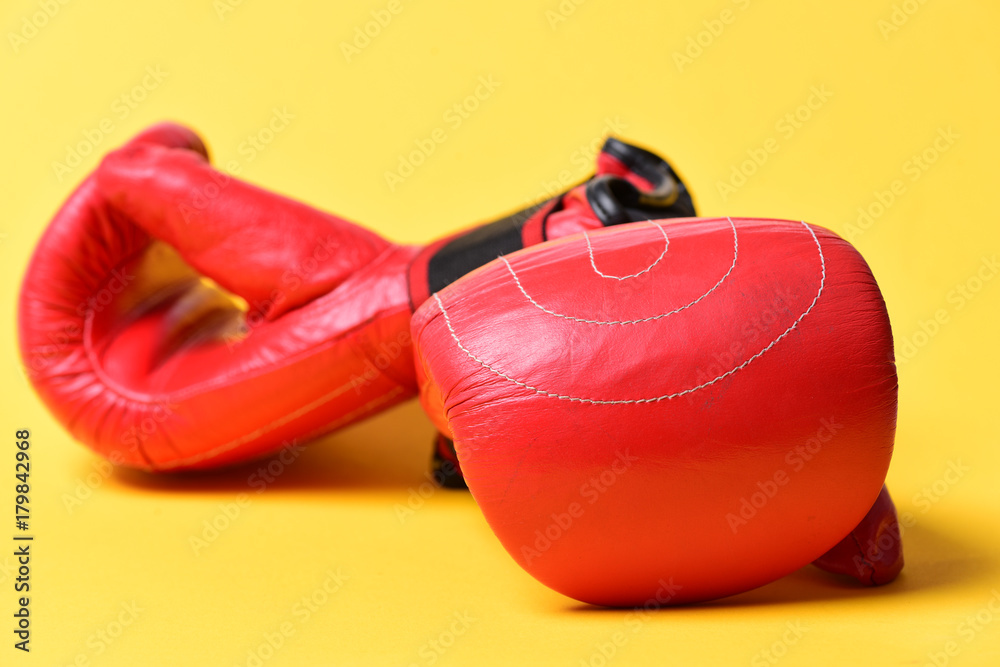 Pair of boxing gloves lying next to each other