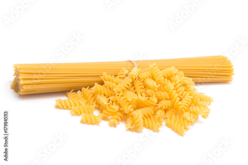 Mix of bunch uncooked italian pasta isolated on white background
