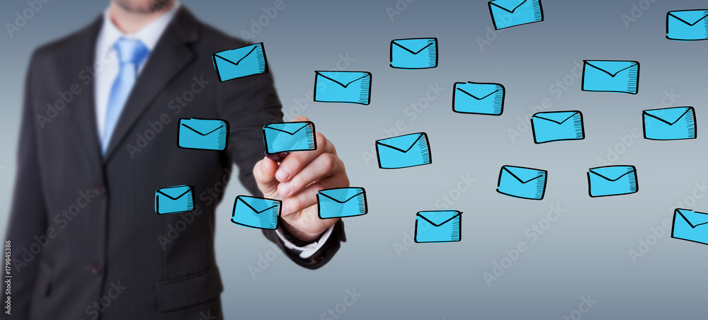 Businessman drawing floating emails sketch Businessman drawing floating emails sketch