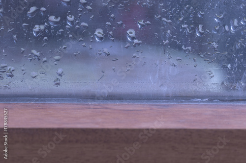 Rainy weather on glass window background