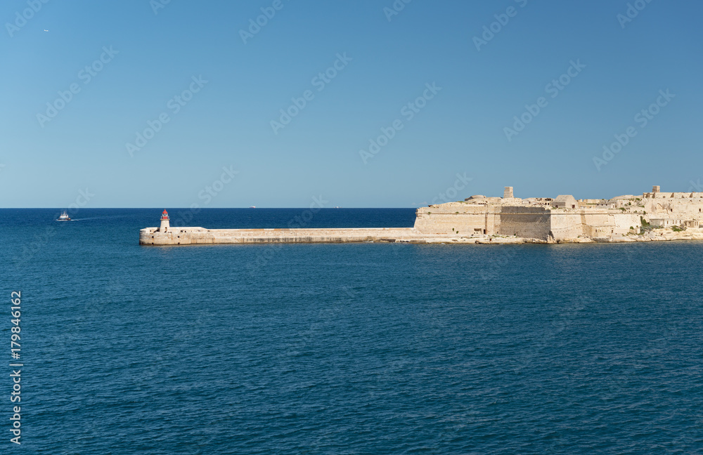 Fort Ricasoli and lighthouse at entrance of the Grand Harbour (Malta)