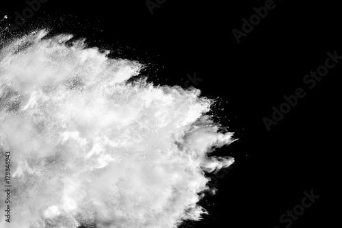 abstract white powder splatted on black background Freeze motion of white powder exploding.