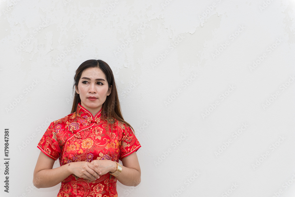 happy Chinese new year. Portrait of Asian woman has red envelope on white wall happy Chinese new year. Portrait of Asian woman has red envelope on white wall