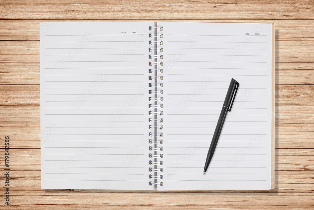 open notebook with pen on wood background open notebook with pen on wood background