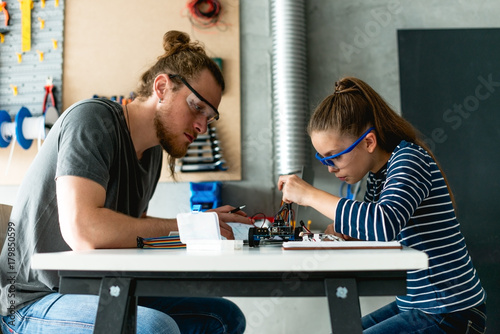 Father and daughter working on important task