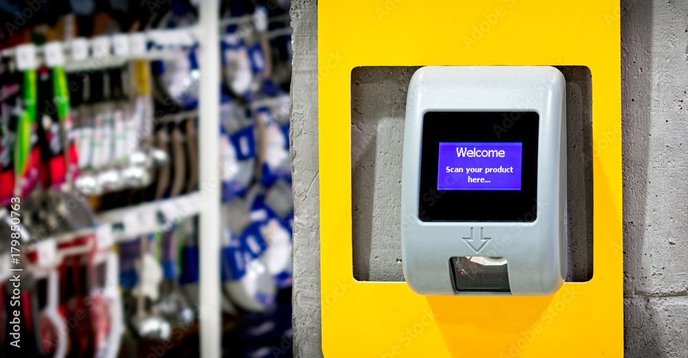 A Barcode Price Scanner Installed on the wall for Customer's Convenience in a Store A Barcode Price Scanner Installed on the wall for Customer's Convenience in a Store