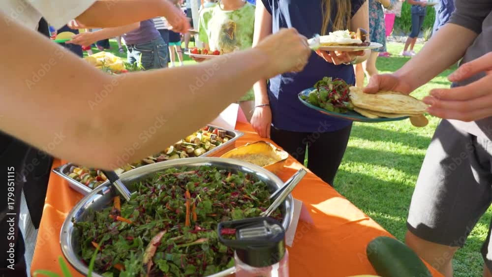 Fresh vegan food salad being served at a community event