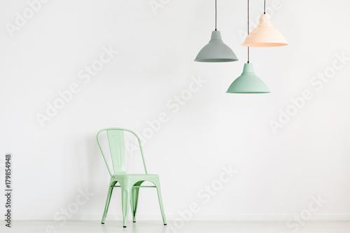 Pastel lamps above mint chair © Photographee.eu