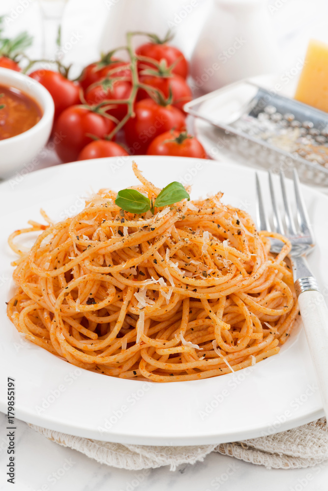 pasta with tomato sauce and ingredients, vertical, closeup pasta with tomato sauce and ingredients, vertical, closeup