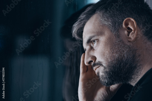 Thoughtful man with withdrawal symptoms