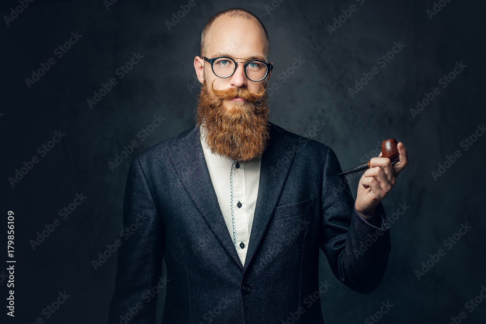 A man smoking pipe over grey background.