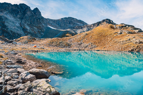Beautiful turquoise alpine lake. Travels in the mountains