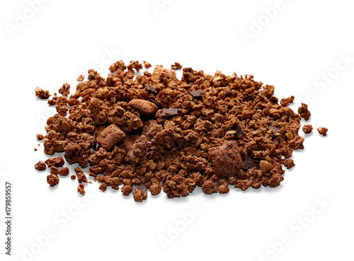 Crunchy granola, muesli pile with chocolate isolated on white background