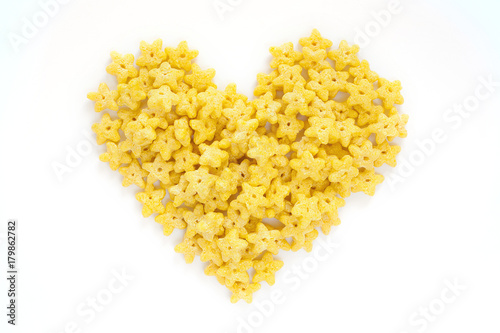Corn Flakes in the form Heart Isolated Top View on White Background