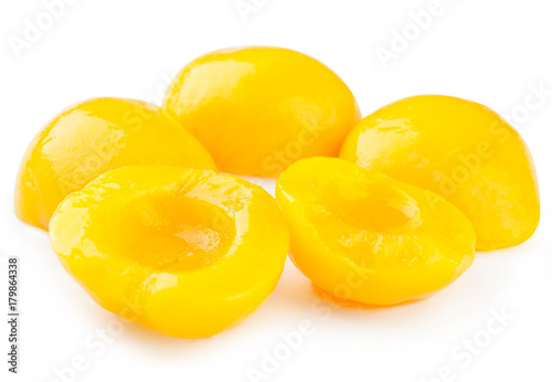 Canned peaches isolated on white background. photo