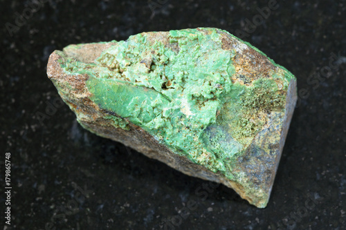 rough Garnierite (nickel ore) stone on dark photo