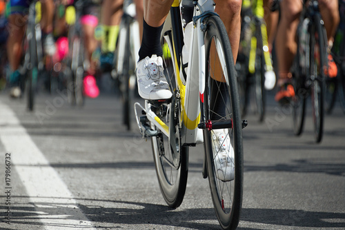 Fototapeta Naklejka Na Ścianę i Meble -  Cycling competition,cyclist athletes riding a race,detail cycling shoes