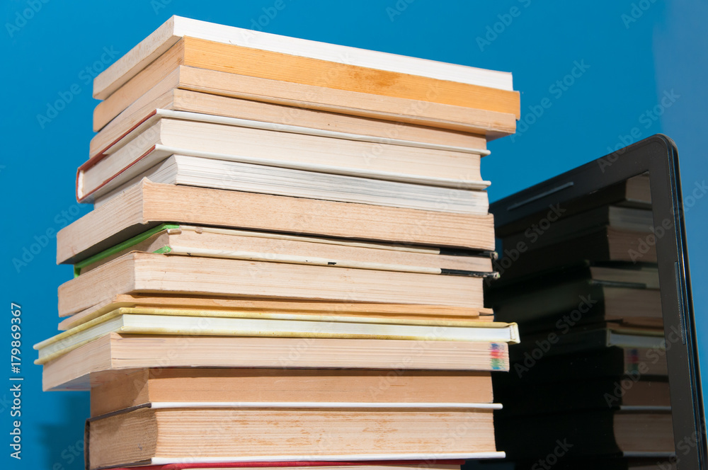 A bunch of books on the laptop. A bunch of books on the laptop.