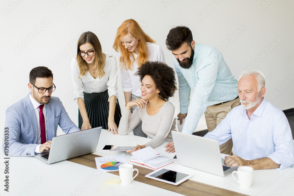 Joyful multiracial business team at work in modern office Joyful multiracial business team at work in modern office