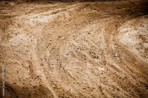 Wheel tracks print on countryside dirt route, background image