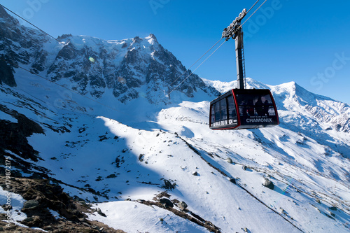A cable car heads to Aiguille du Midi in the Alps (Chamonix, France) photo