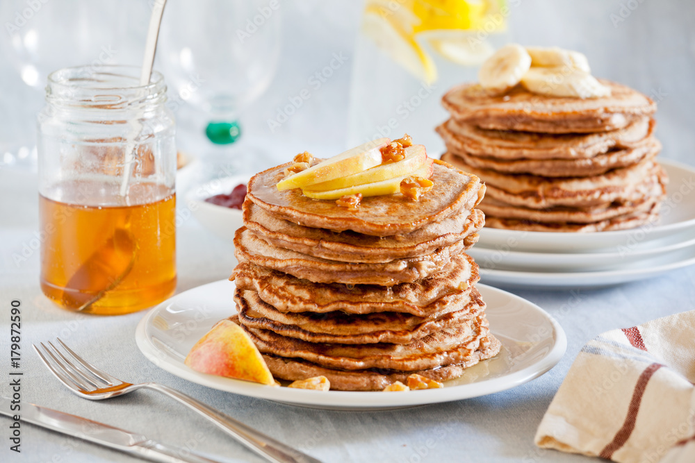 Stacks Of Homemade Whole Wheat Pancakes With Apple Slices Stacks Of Homemade Whole Wheat Pancakes With Apple Slices