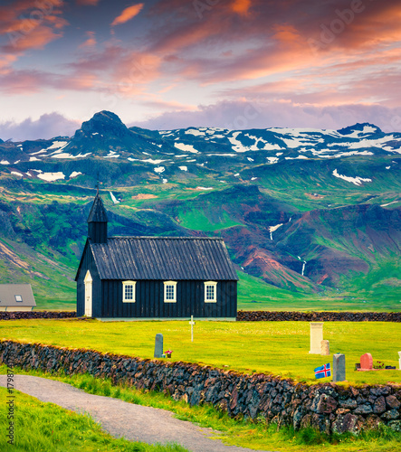 Black wooden Budakirkja church and cemetery at Saefellsnes. photo