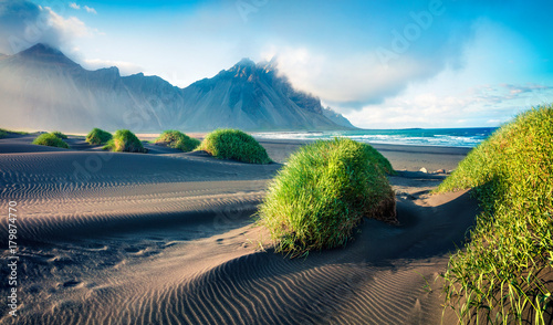 Black sand dunes on the Stokksnes headland on southeastern Icelandic coast with Vestrahorn (Batman Mountain).
